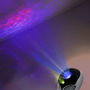 Petit alien de décoration que projette des étoiles au plafond